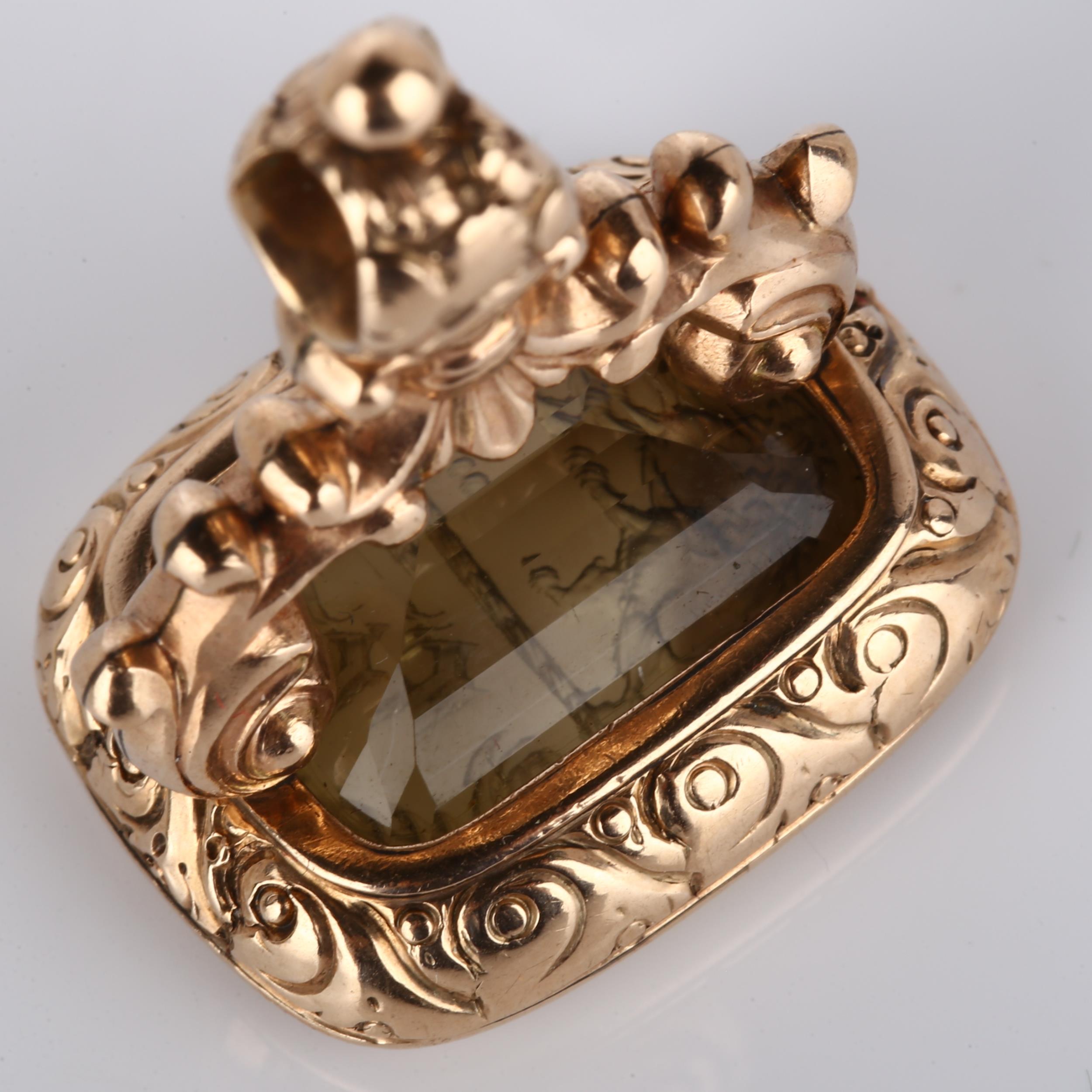 A Victorian smoky quartz seal fob, with intaglio carved rampant lion emblem and initials below, in - Image 3 of 4