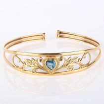 A modern 9ct gold blue topaz heart torque bracelet, openwork floral design, setting height 13.9mm,