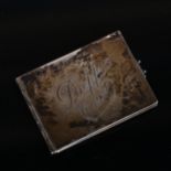 An early 20th century Continental novelty silver folding pocket picture frame, the cover engraved "