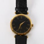 GUCCI - a lady's gold plated quartz wristwatch, black dial with Roman numeral hour markers and black