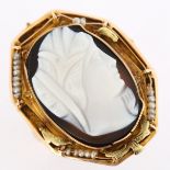 An Antique hardstone cameo ring, 9ct gold settings with relief carved panel depicting female profile