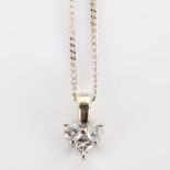 A modern 9ct white gold diamond spade pendant necklace, on 9ct fine curb link chain, total diamond