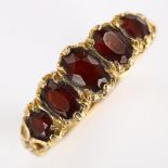 A late 20th century 9ct gold graduated five stone garnet half hoop ring, hallmarks London 1971,