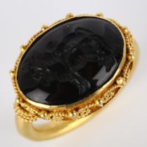 A Victorian style seal ring, unmarked high carat gold settings with wirework surround and intaglio