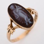 An early 20th century 9ct rose gold hardstone cameo ring, relief carved panel depicting female