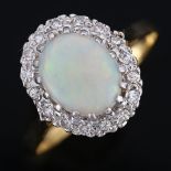 An 18ct gold opal and diamond cluster ring, set with oval cabochon opal and single-cut diamonds,