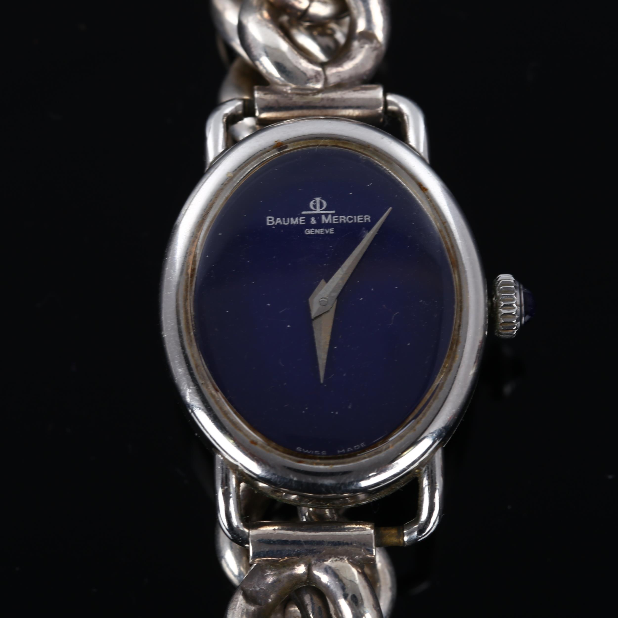 BAUME & MERCIER - a lady's silver mechanical bracelet watch, ref. 1800, oval blue dial with cabochon