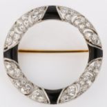 TIFFANY & CO - an Art Deco onyx and diamond brooch, unmarked white metal settings in circular