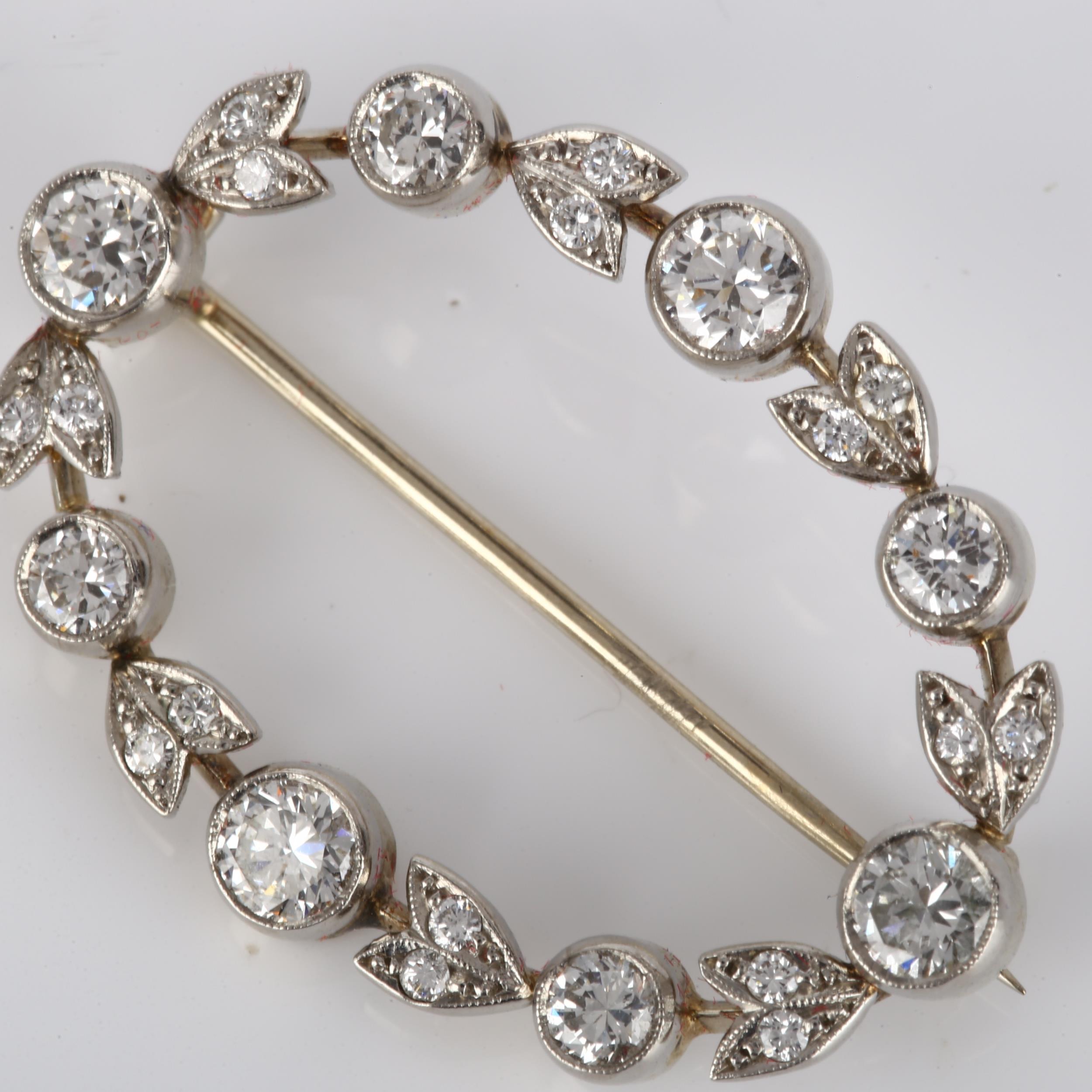 A Belle Epoque diamond brooch, openwork oval form with floral design set with modern round - Image 2 of 4