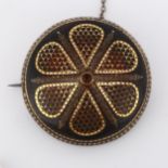 A Victorian tortoiseshell gold and silver pique inlaid bombe shield brooch, diameter 40.9mm, 10g