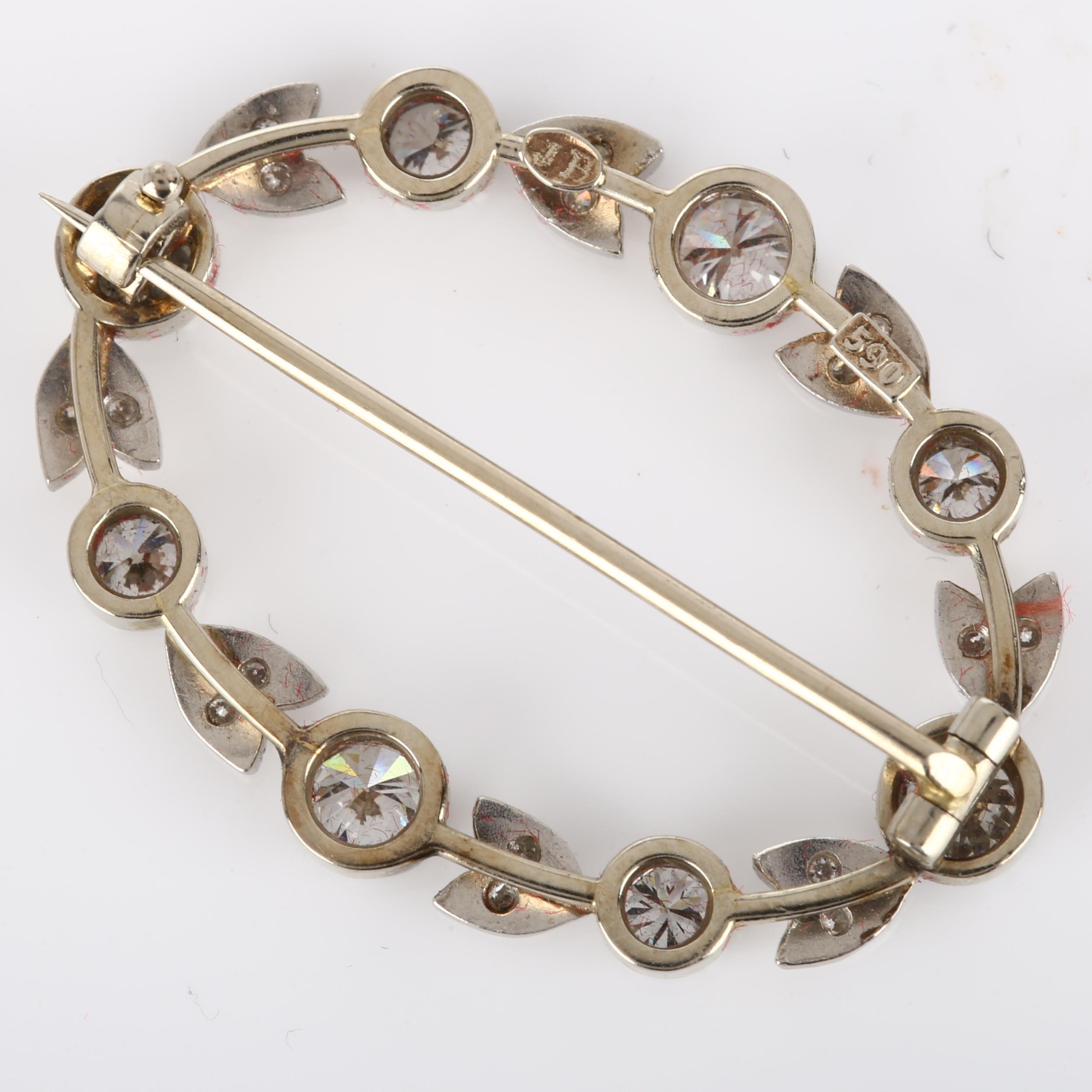 A Belle Epoque diamond brooch, openwork oval form with floral design set with modern round - Image 4 of 4