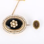 A Victorian onyx and pearl cluster mourning brooch, unmarked gold settings, and an Antique gilt-