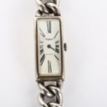 PHIGIED - a lady's heavy sterling silver mechanical bracelet watch, curved rectangular white dial