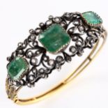 A fine Victorian emerald and diamond hinged bangle, unmarked gold and silver-topped openwork