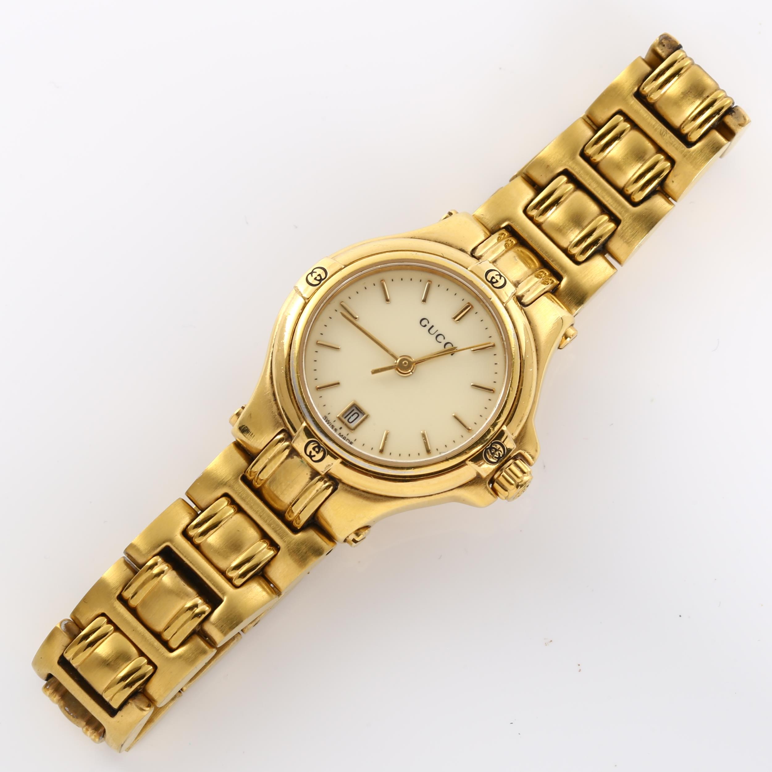GUCCI - a lady's gold plated 9240L quartz bracelet watch, cream dial with gilded baton hour markers, - Image 2 of 5