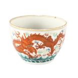 A Chinese porcelain bowl, with iron red painted dragons and pearls, 6 character mark, diameter 10cm,