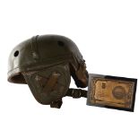 A post World War II French armoured troop helmet, named to "Willett" and an Army swimming