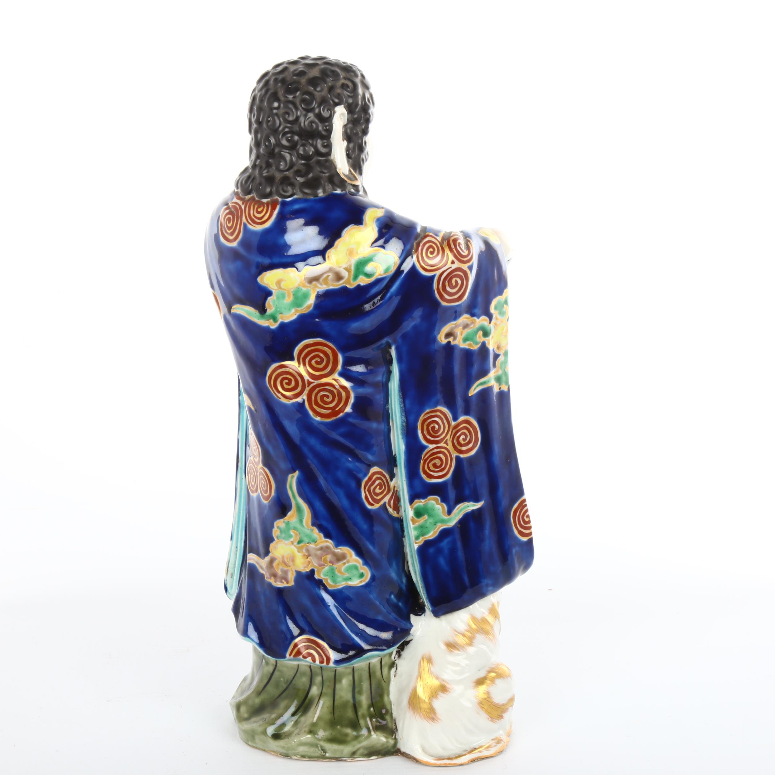 A Japanese porcelain figure with a goat, gilded blue glaze robes, height 30cm Goat is missing his - Bild 2 aus 3