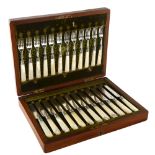 A set of hallmarked silver and mother-of-pearl handled dessert knives and forks for 12 people, in