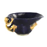 A Chinese blue and yellow glaze libation cup, with chilong dragon mounts, length 12cm Good