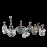 A group of 9 silver-mounted perfume bottles, including 1 with a pink enamel collar, tallest 17cm (9)