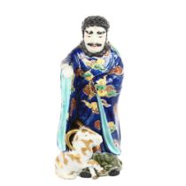 A Japanese porcelain figure with a goat, gilded blue glaze robes, height 30cm Goat is missing his