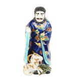 A Japanese porcelain figure with a goat, gilded blue glaze robes, height 30cm Goat is missing his