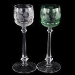 MOSER GLASS - a pair of green and clear glass long-stemmed glasses, with engraved floral bowls,