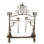 An exceptional late 17th century wrought-iron andiron for an inglenook fireplace, the joined pair
