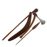 A group of Tribal implements, comprising an Australian boomerang, a rootwood club/knobkerry (