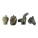 4 Ancient Phoenician glass heads, circa 1st century BC, lion head height 6.5cm (4)
