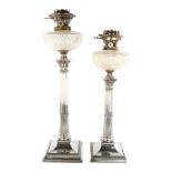 A graduated pair of Hinks Corinthian column oil lamps, electroplate and cut-glass, height 62cm and