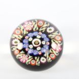 A Millefiori glass paperweight, diameter 7cm, height 5.5cm Perfect condition