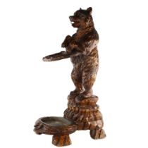 19th century Black Forest carved wood standing bear design stick stand, original metal tray liner,