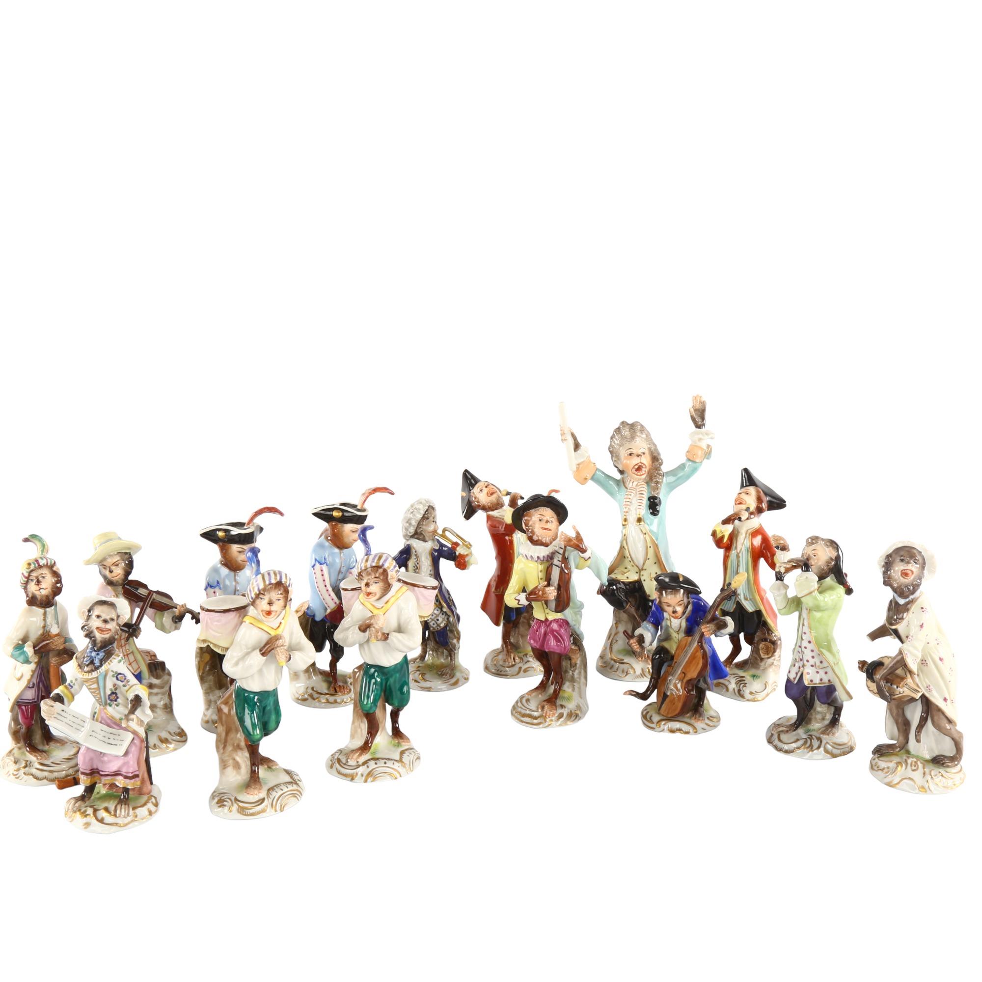 A collection of early 20th century German Volkstedt porcelain monkey band figures, largest height