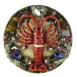 A Palissy style lobster and crustacean decorated pottery plate, indistinct impressed marks, diameter