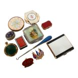 A group of enamel compacts, pillboxes and other items
