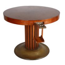 An Austrian Secessionist games table, circular top with pull out and drop down drinks holders,
