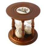 A reproduction mahogany 3-section egg timer, diameter 14cm, height 14cm