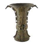 A Chinese Archaic style bronze Gu shaped vase, with script mark to base, height 31cm