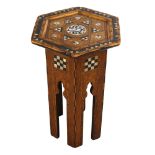A small Anglo-Moorish hexagonal occasional table in the manner of Liberty & Co, with inlaid mother-