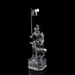 A German parcel gilt sterling silver figure of a knight and stag, possibly by B Neresheimer & Sohne,