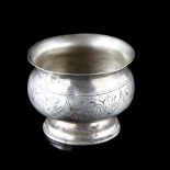 A 19th century Russian silver salt cellar, with bright-cut engraved decoration, diameter 5cm, 0.