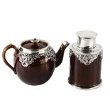 An Edwardian silver-mounted stoneware pottery bachelor's teapot and tea caddy, relief embossed