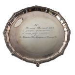 An Elizabeth II silver salver, circular form with Celtic design border and personalised