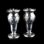 A pair of late Victorian silver trumpet bud vases, fluted rims with relief embossed floral