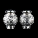 A pair of Victorian silver globular vases, allover relief embossed foliate decoration, by Horace