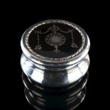 An Edwardian silver and tortoiseshell dressing table powder box, circular form with silver plique