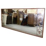 A large decorative bistro wall mirror, with gilded Classical decoration, height 102cm, length