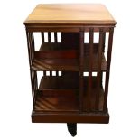 An Edwardian mahogany revolving bookcase, height 86cm, 50cm Sq Good structural condition, slight sun